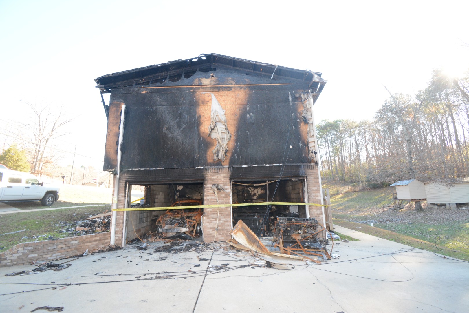 Burned vehicle in a garage